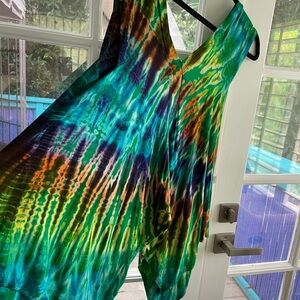 Bright green tie die top from Indonesia , very pretty colors fun to wear.